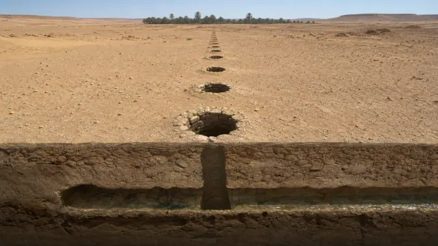 إعادة تصوّر تاريخية خاصة بنفق غير مرئي ترسمه آبار على السطح، وادي الآجال وفزّان، ≈400 ق.م.–700 م.